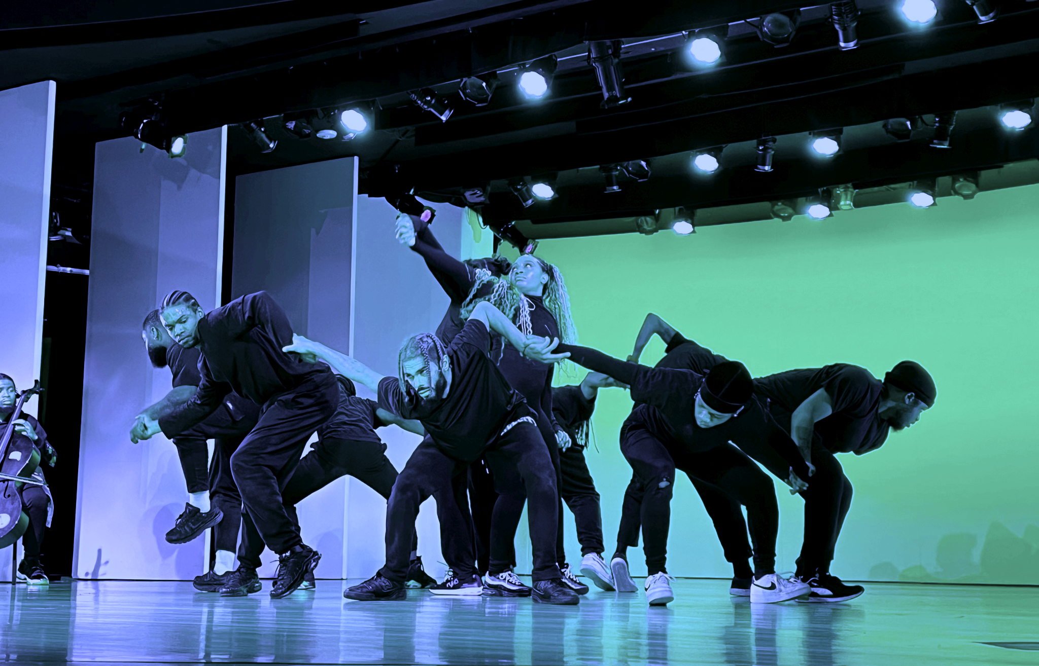 there is a group of people that are performing on a stage